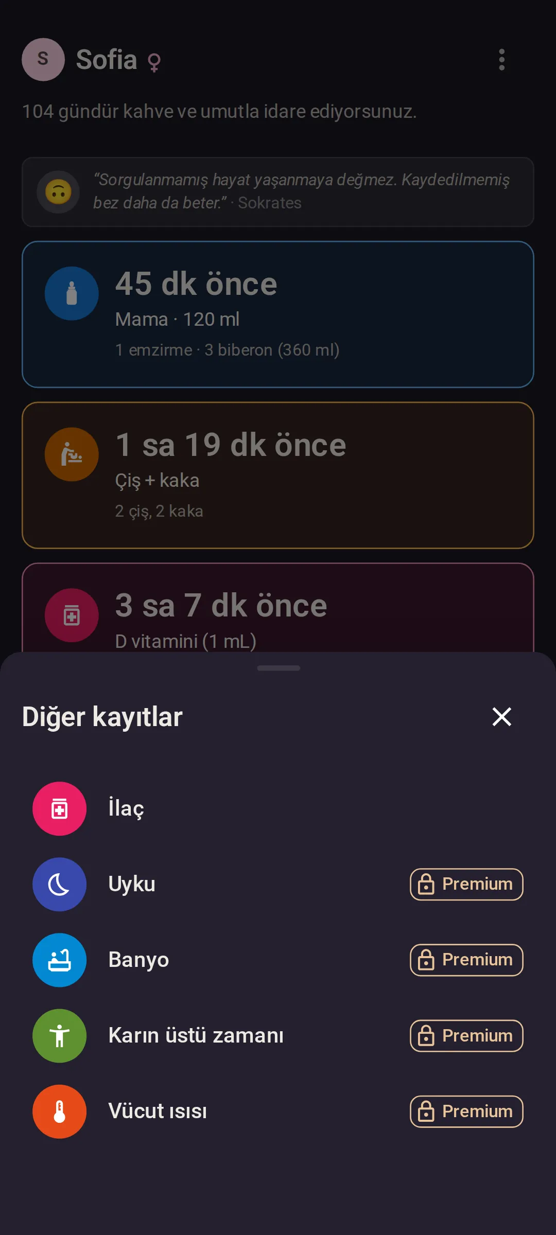 “Bugün” ekranının üzerinde açık “Diğer kayıtlar” paneli: ilk satırda İlaç, ardından Uyku, Banyo, Karın üstü zamanı ve Vücut ısısı; ücretsiz planda son dördünün her birinde kilitli bir Premium etiketi var.