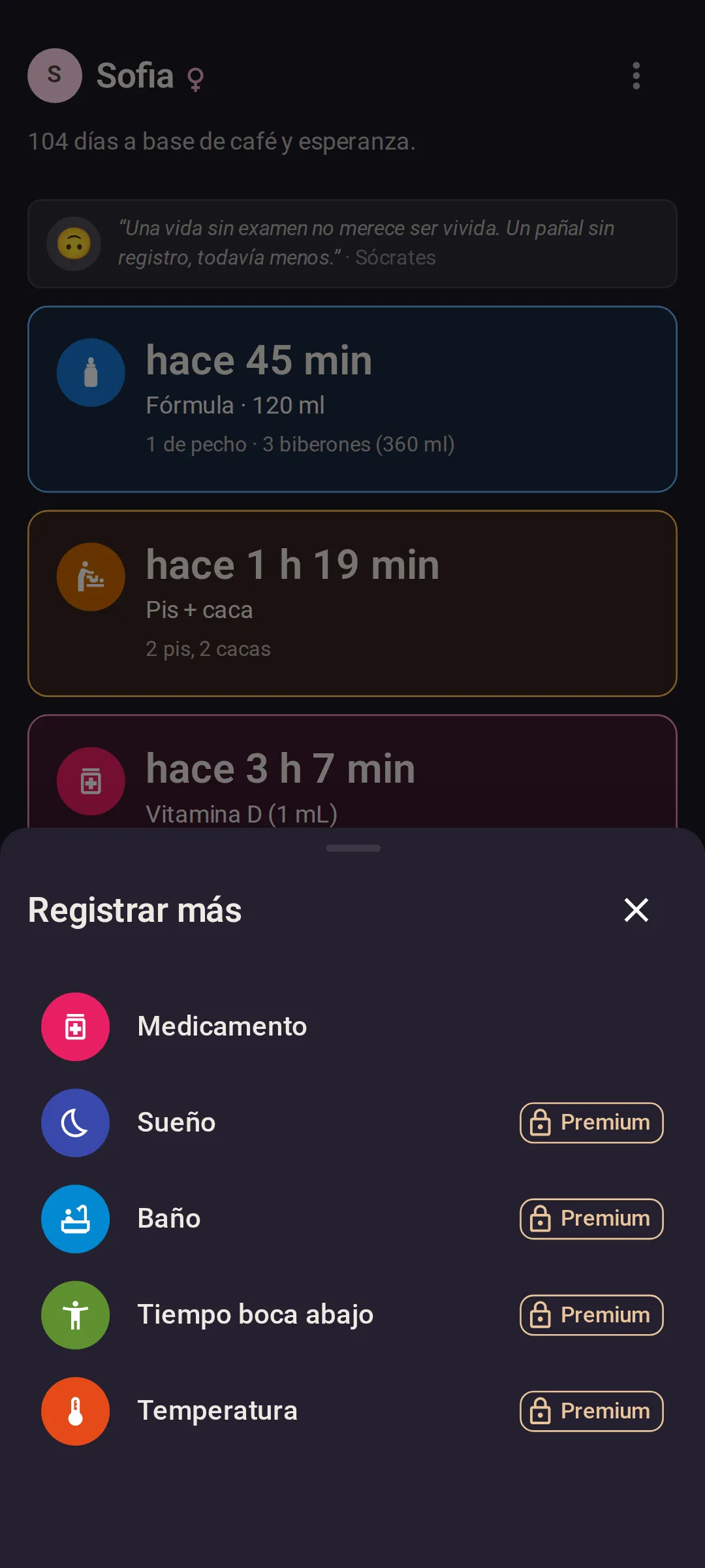 El menú Registrar más sobre la pantalla Hoy: primero Medicamento, luego Sueño, Baño, Tiempo boca abajo y Temperatura, estos cuatro últimos con una etiqueta Premium y un candado en el plan gratuito.