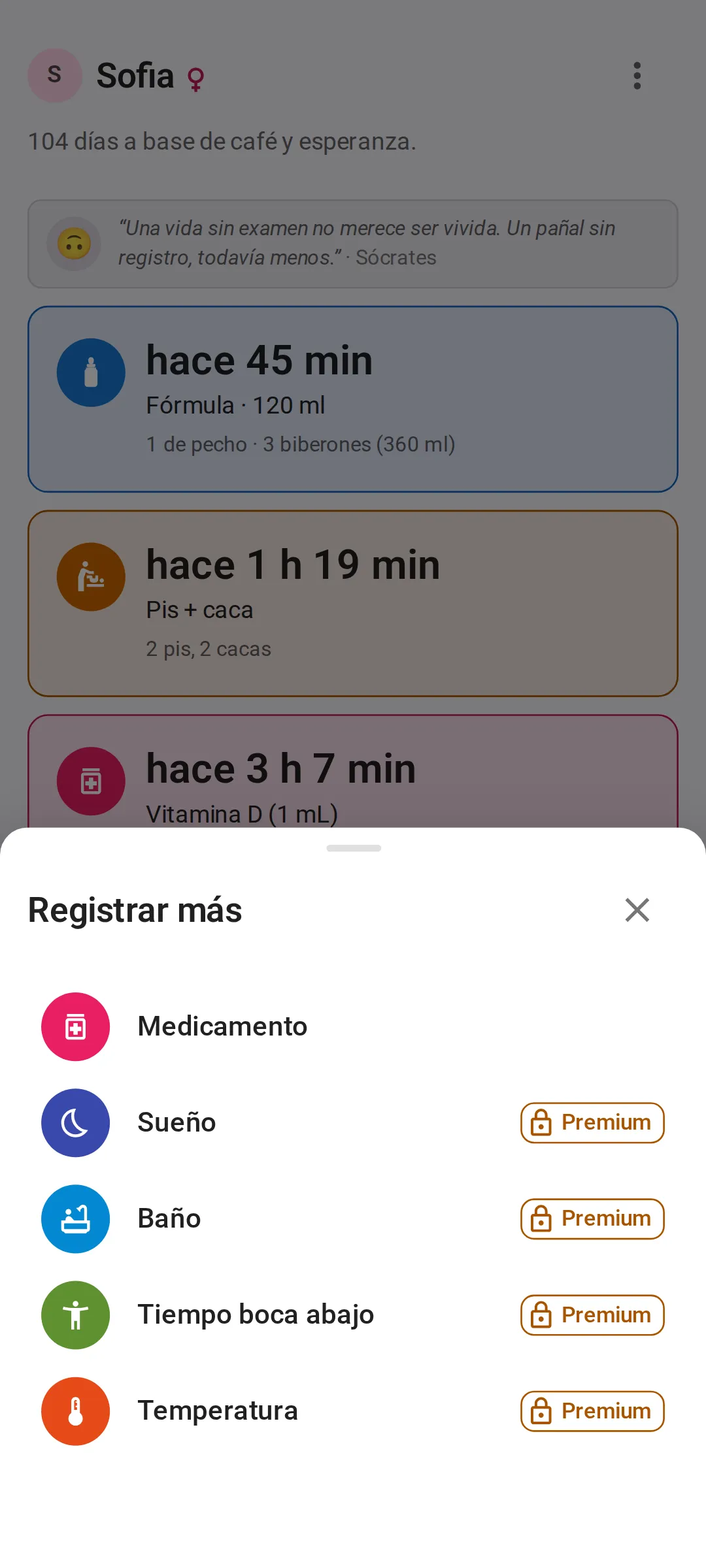 El menú Registrar más sobre la pantalla Hoy: primero Medicamento, luego Sueño, Baño, Tiempo boca abajo y Temperatura, estos cuatro últimos con una etiqueta Premium y un candado en el plan gratuito.
