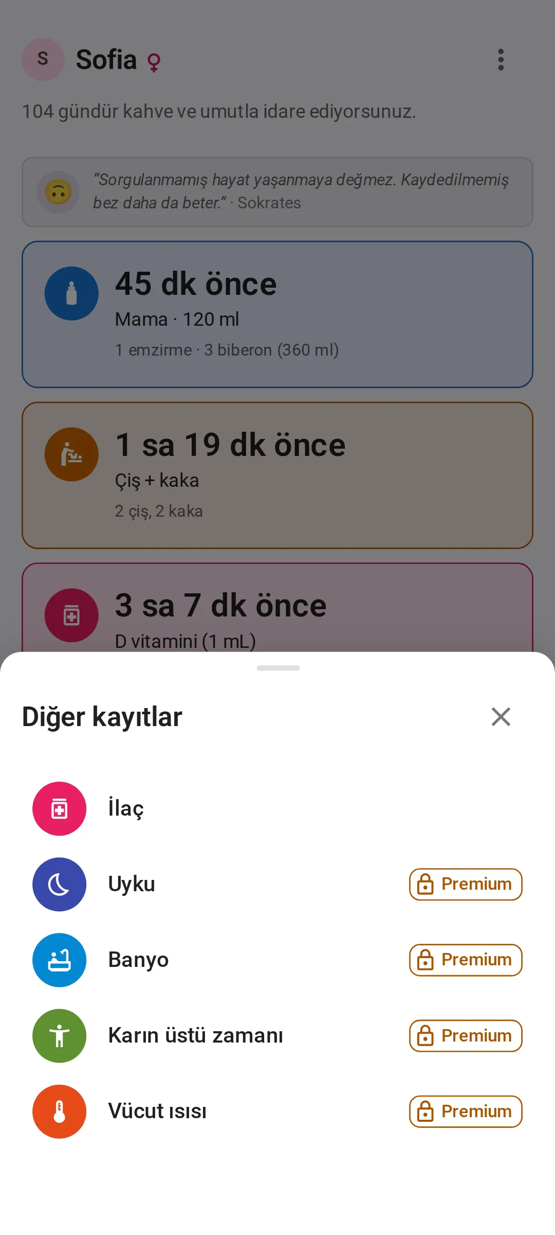 “Bugün” ekranının üzerinde açık “Diğer kayıtlar” paneli: ilk satırda İlaç, ardından Uyku, Banyo, Karın üstü zamanı ve Vücut ısısı; ücretsiz planda son dördünün her birinde kilitli bir Premium etiketi var.