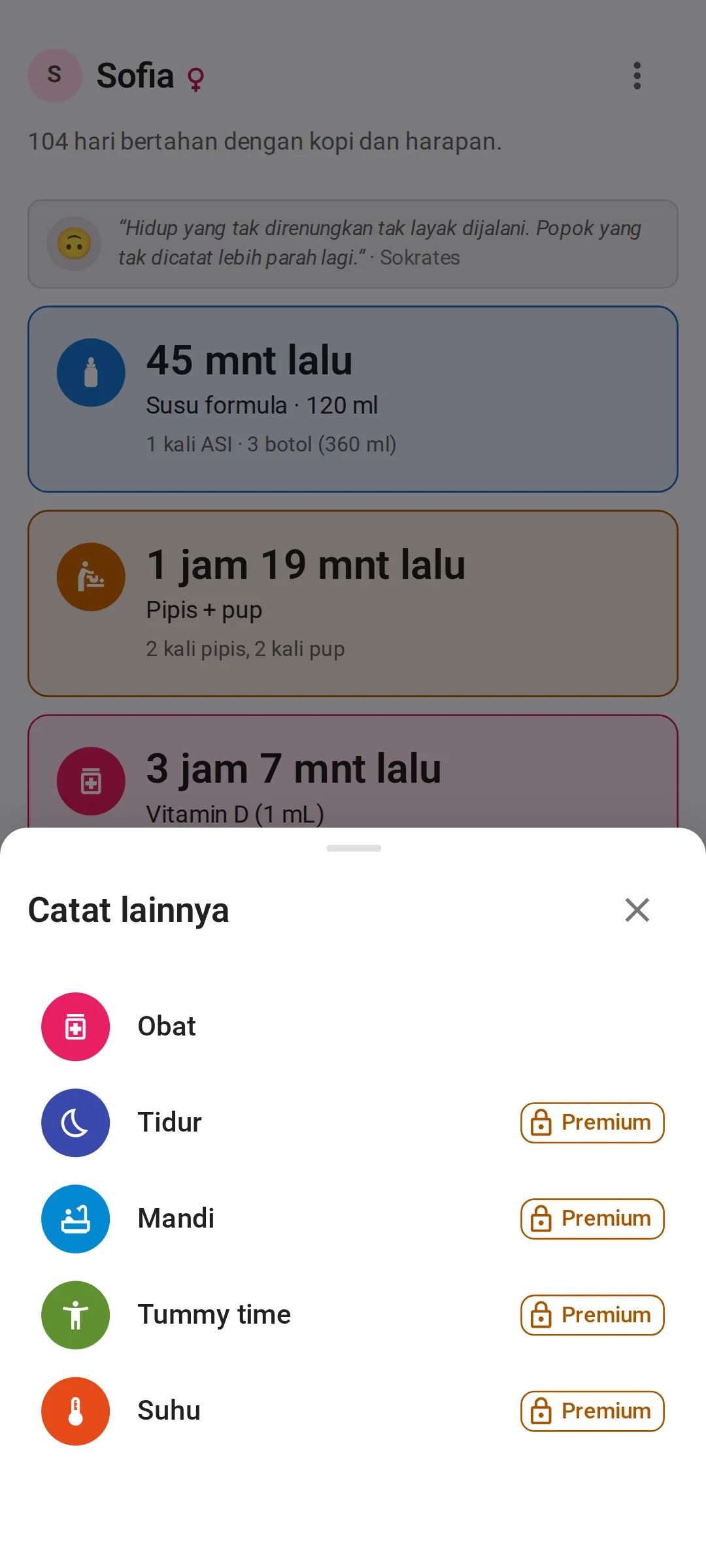 Lembar “Catat lainnya” terbuka di atas layar “Hari ini”, dengan Obat di baris pertama, lalu Tidur, Mandi, Tummy time, dan Suhu, empat terakhir masing-masing dengan label Premium dan ikon gembok di paket gratis.