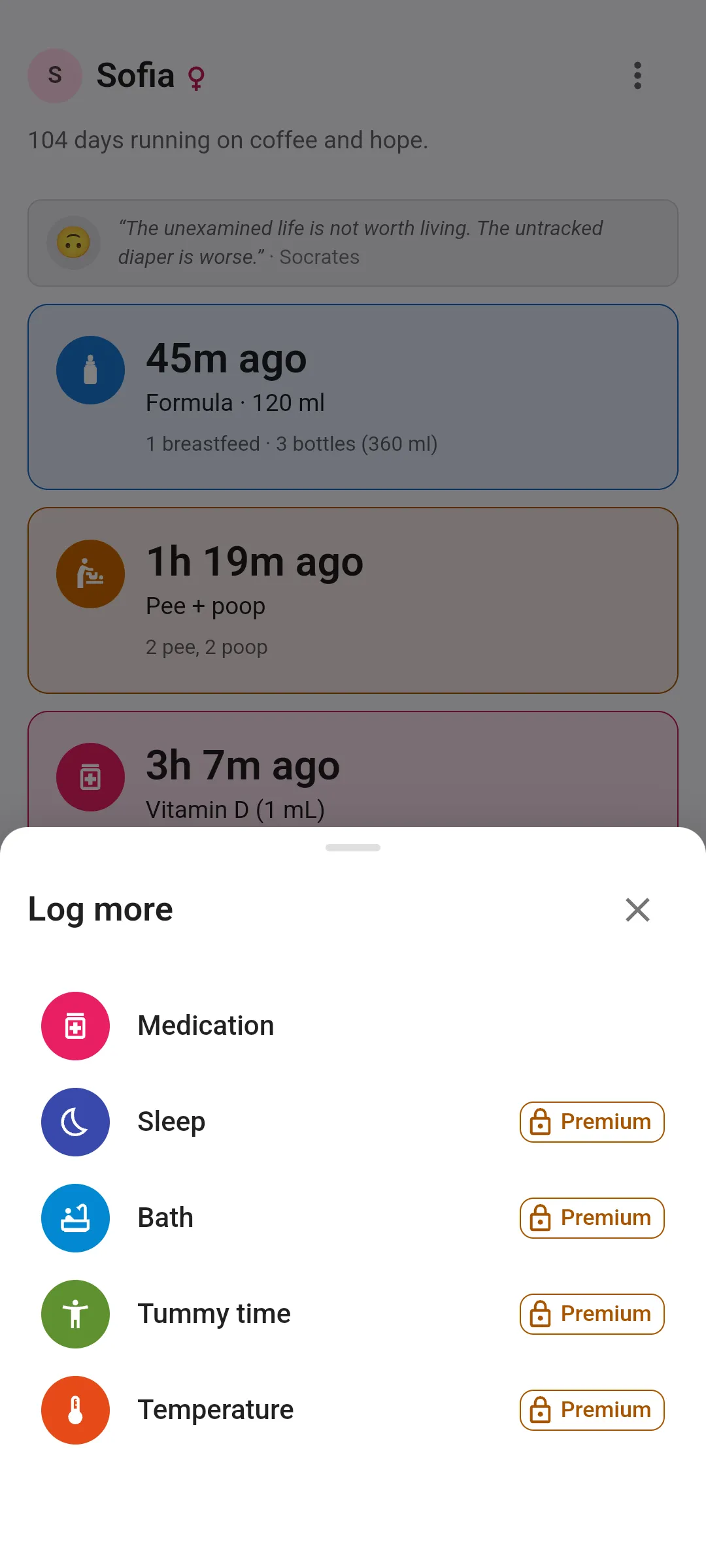 The Log more sheet open over the Today screen, with Medication as the first row, then Sleep, Bath, Tummy time and Temperature, the last four each carrying a Premium tag with a lock on the free plan.